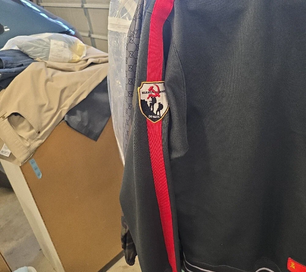 The North Face Dark Green Track Jacket with Red & Yellow Accents